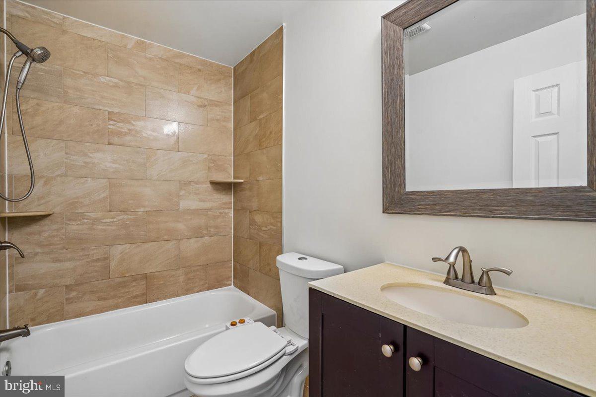 1339 C Street Northeast Washington, DC 20002 - Photo 19 of 24 a bathroom with a sink a toilet and shower