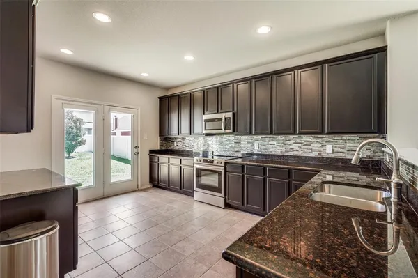 a view of hallway with wooden floor and window