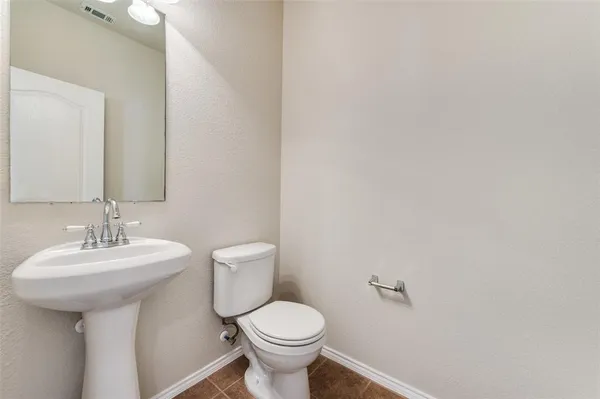 a large kitchen with stainless steel appliances granite countertop a stove and a sink