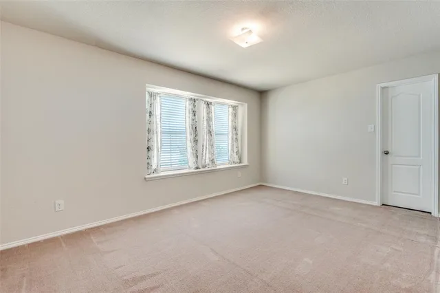 a bathroom with a sink a toilet and shower curtain