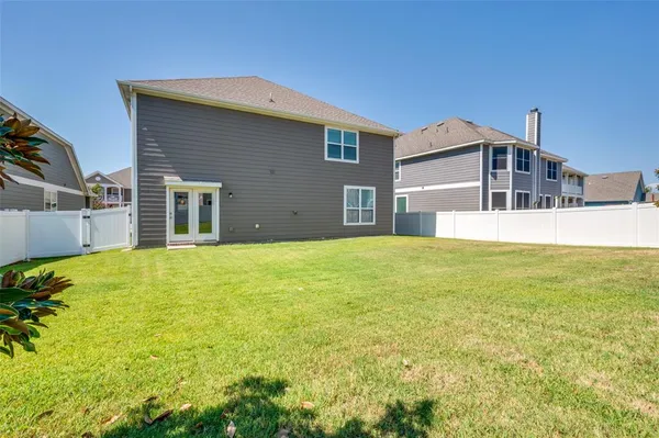 a house view with swimming pool in front of it
