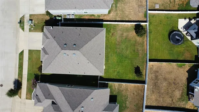 an aerial view of a house with a garden