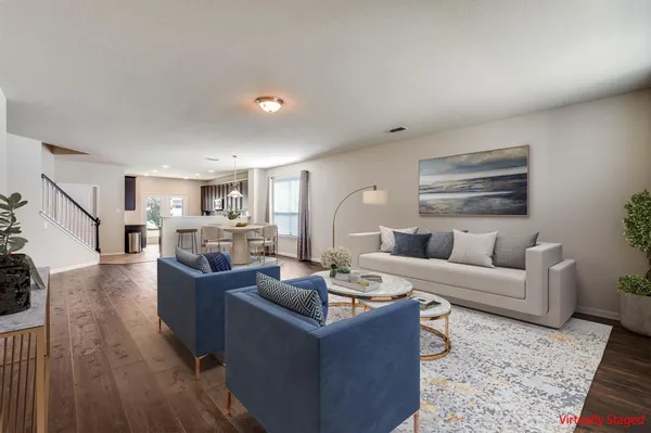 an empty room with wooden floor and white walls