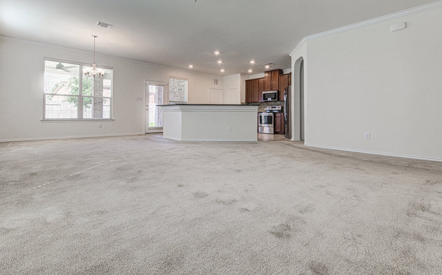 1237 Volente Lane Leander, TX 78641 - Photo 21 of 22 An open floorplan seamlessly connects the living space to a well-appointed kitchen.