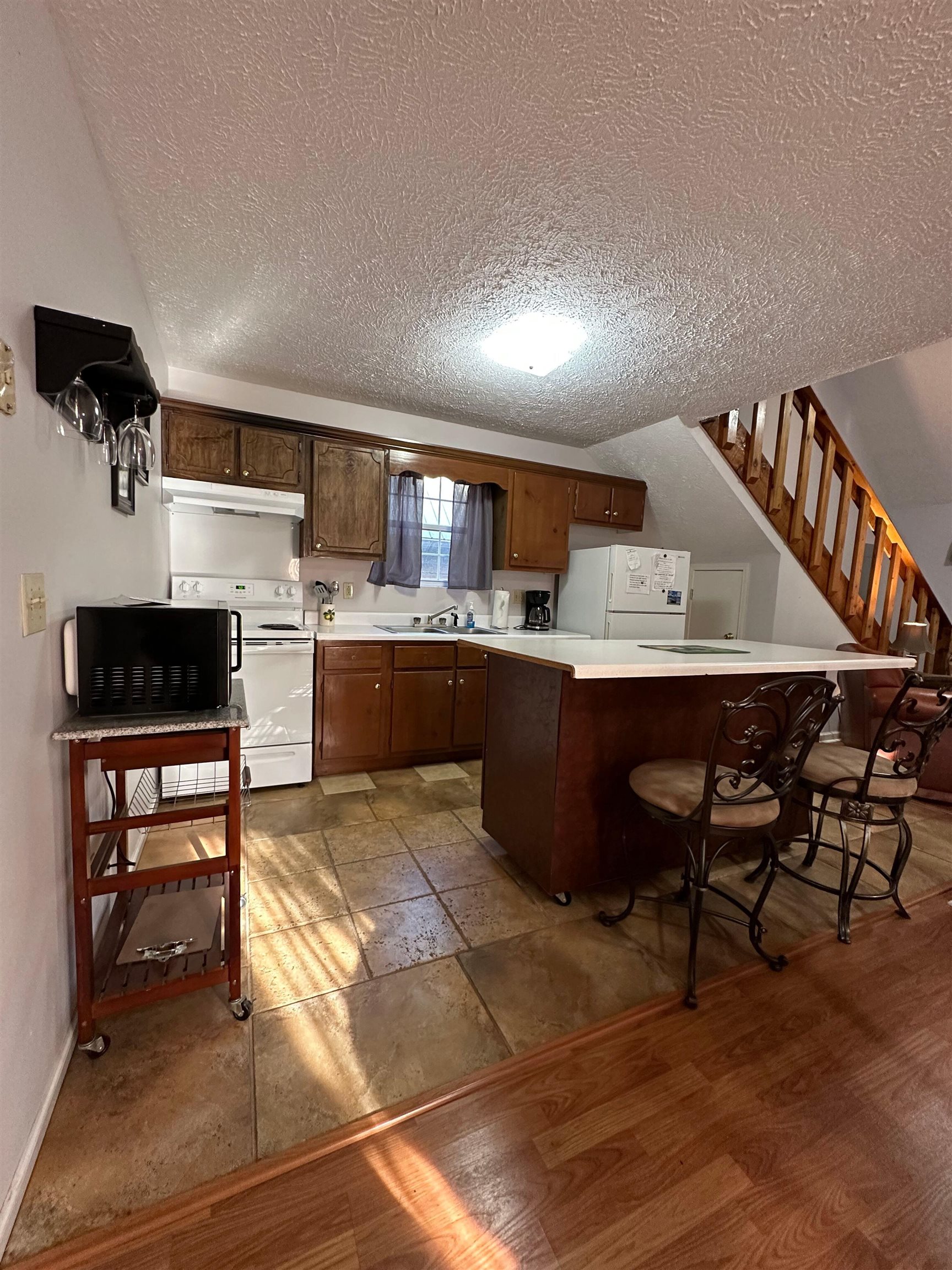 185 Wayson Road Counce, TN 38326 - Photo 11 of 16 a living room with stainless steel appliances kitchen island granite countertop furniture a rug and a kitchen view
