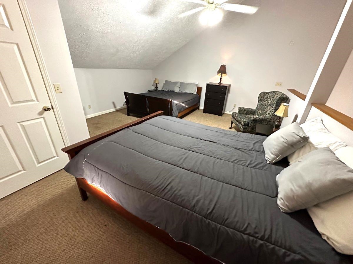 185 Wayson Road Counce, TN 38326 - Photo 14 of 16 a bedroom with a bed and a mirror