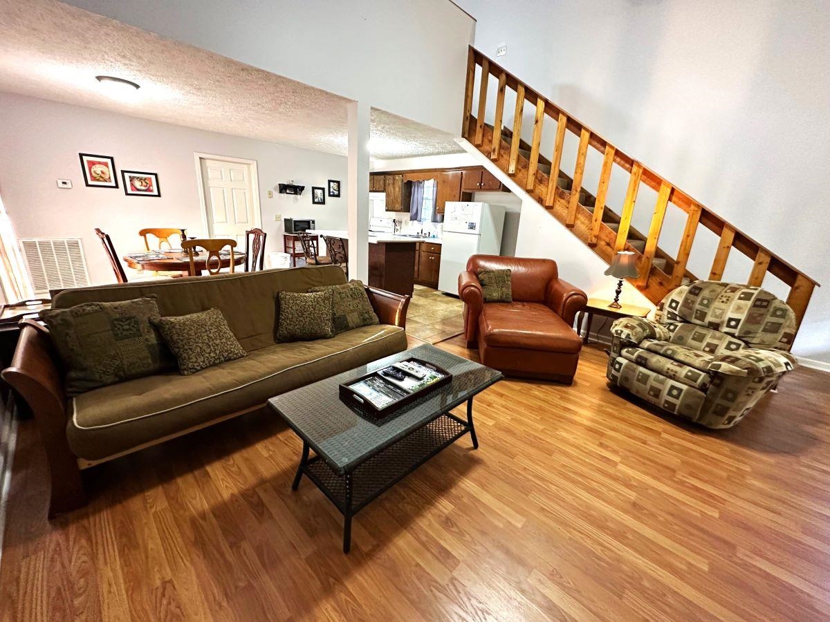 185 Wayson Road Counce, TN 38326 - Photo 4 of 16 a living room with furniture and a wooden floor