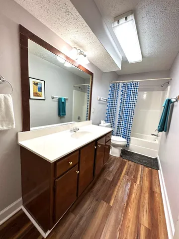 a bathroom with a sink a mirror and a bathtub