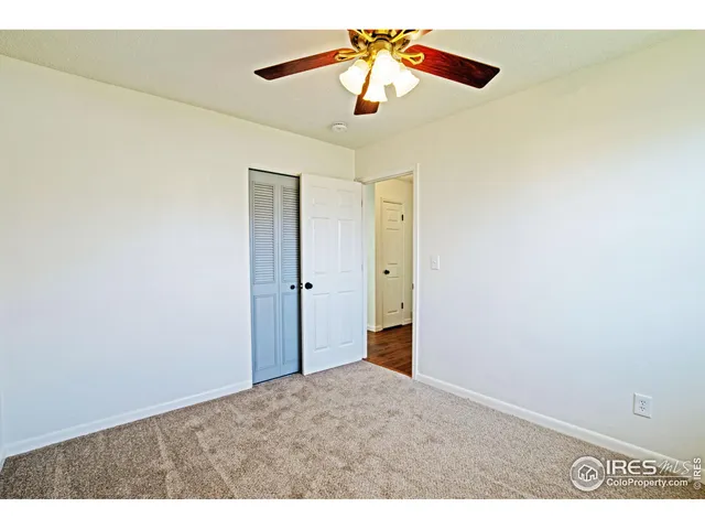 a view of a chandelier fan in a room