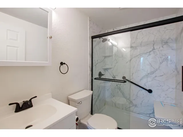 a bathroom with a sink and a shower