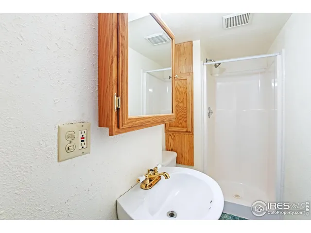 a bathroom with a bathtub and a sink