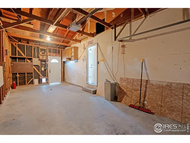 a view of an empty room with stairs