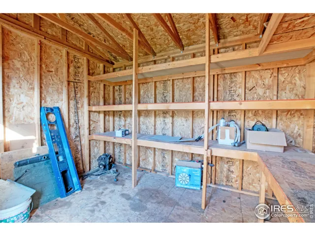 a view of a porch with a table and chairs