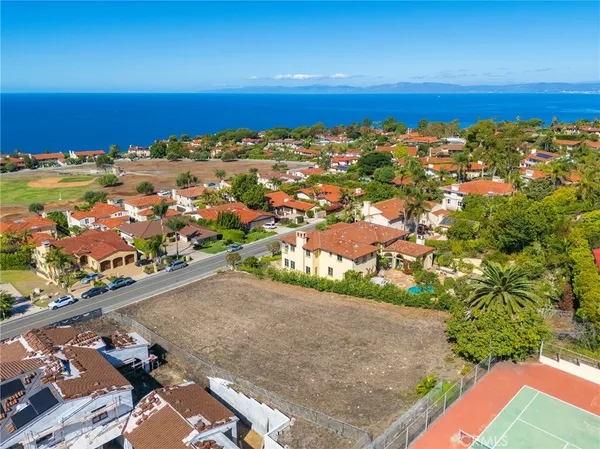 an aerial view of residential building and ocean