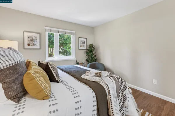 a bedroom with bed and a window