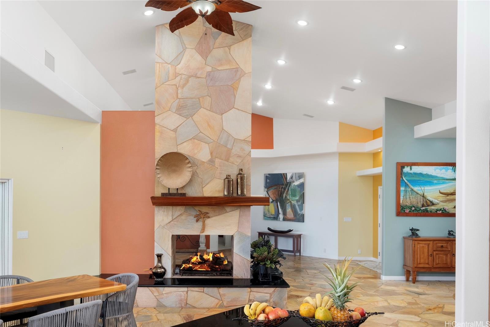 31-212 Hawaii Belt Road Hakalau, HI 96710 - Photo 6 of 25 Vaulted ceilings and a cozy fireplace create an inviting, open space with warmth and character