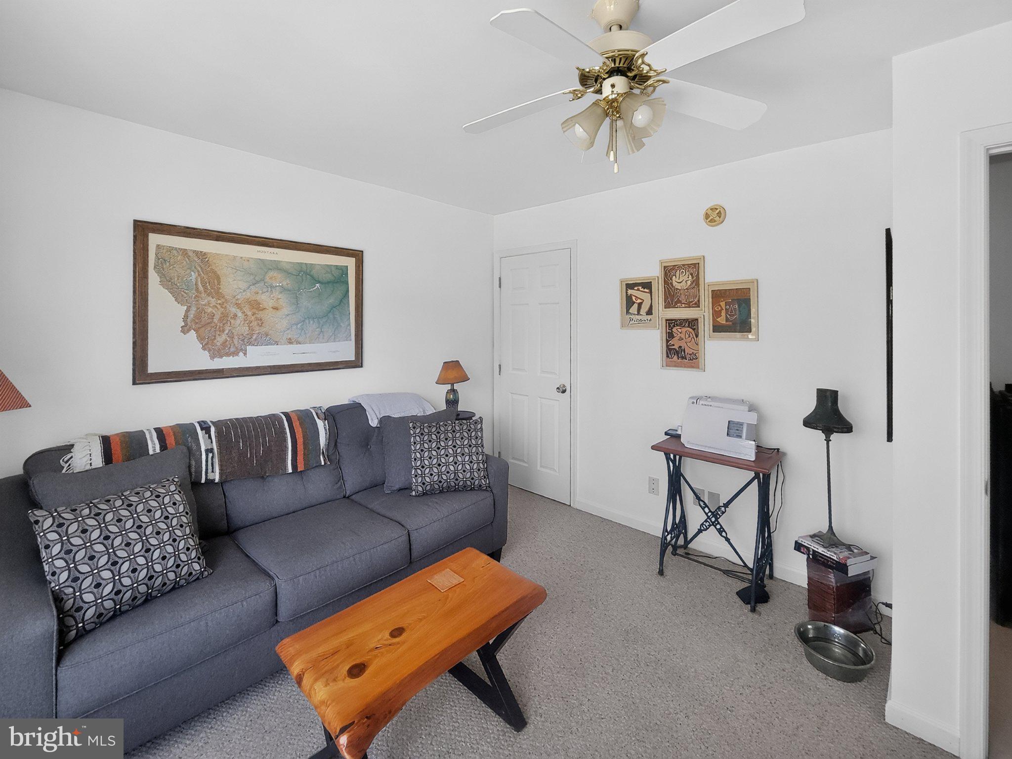 5214 David Greene Road Cambridge, MD 21613 - Photo 32 of 73 Cozy living space with artistic flair.