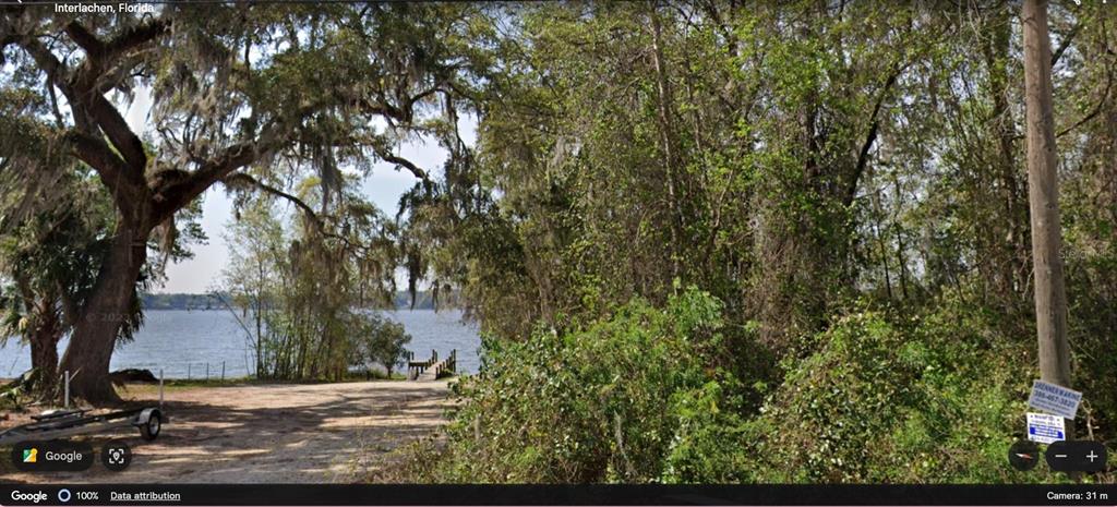 0 Kin Street Interlachen, FL 32148 - Photo 7 of 11 a view of a yard with plants and trees