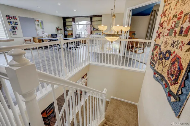 a view of a kitchen with furniture and wooden floor