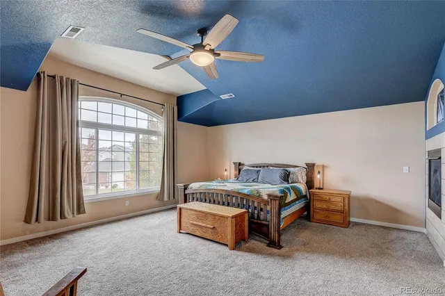 a bed sitting in a room next to a window