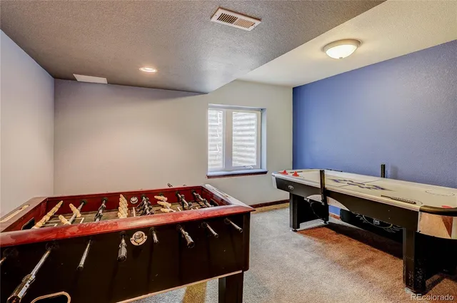 a bedroom with a bed and a desk