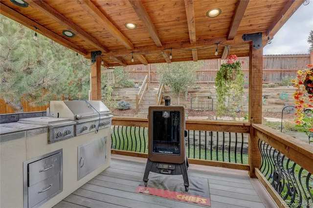 a view of a chairs and table in the balcony