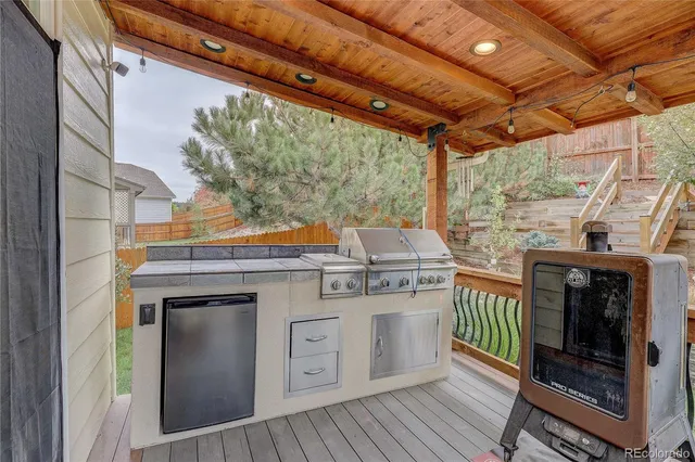 a stove top oven sitting inside of a kitchen