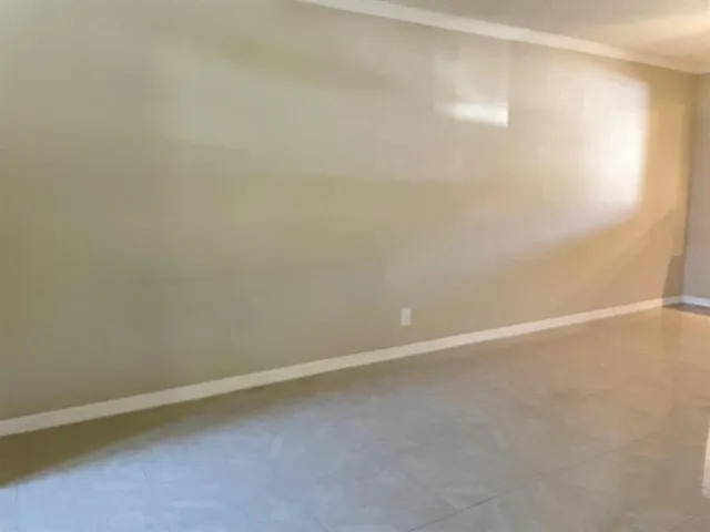 a view of a hallway with a window