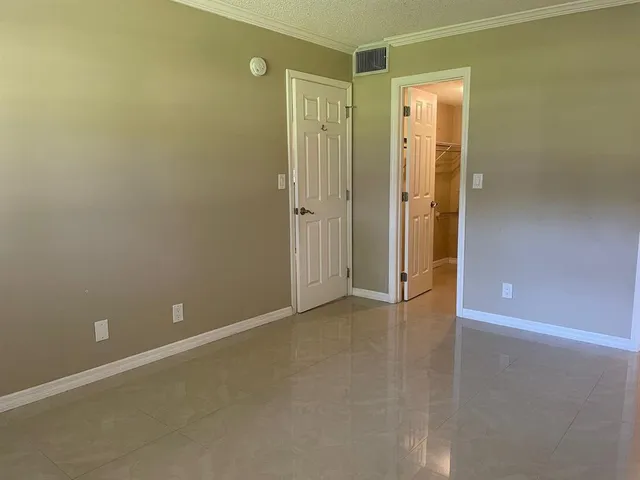 an empty room and windows