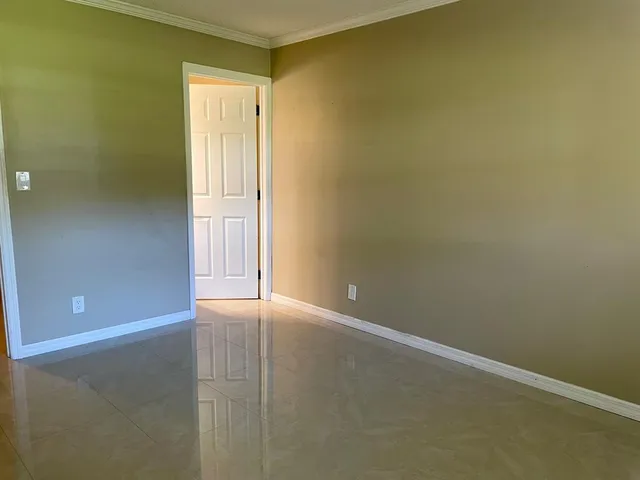 a bathroom with a granite countertop bathtub and toilet
