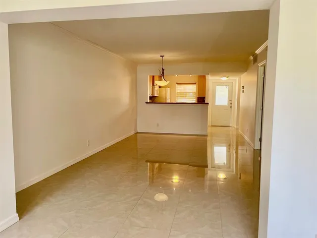 a bathroom with a granite countertop sink a toilet and mirror