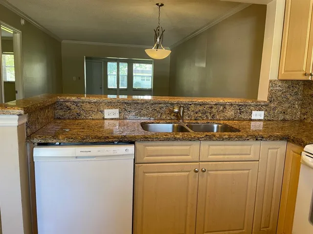 a stove top oven sitting inside of a kitchen