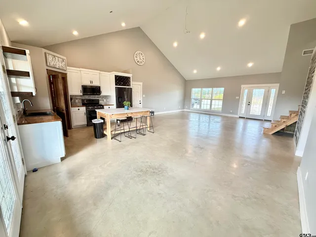 a view of a living room a livingroom with furniture and a flat screen tv