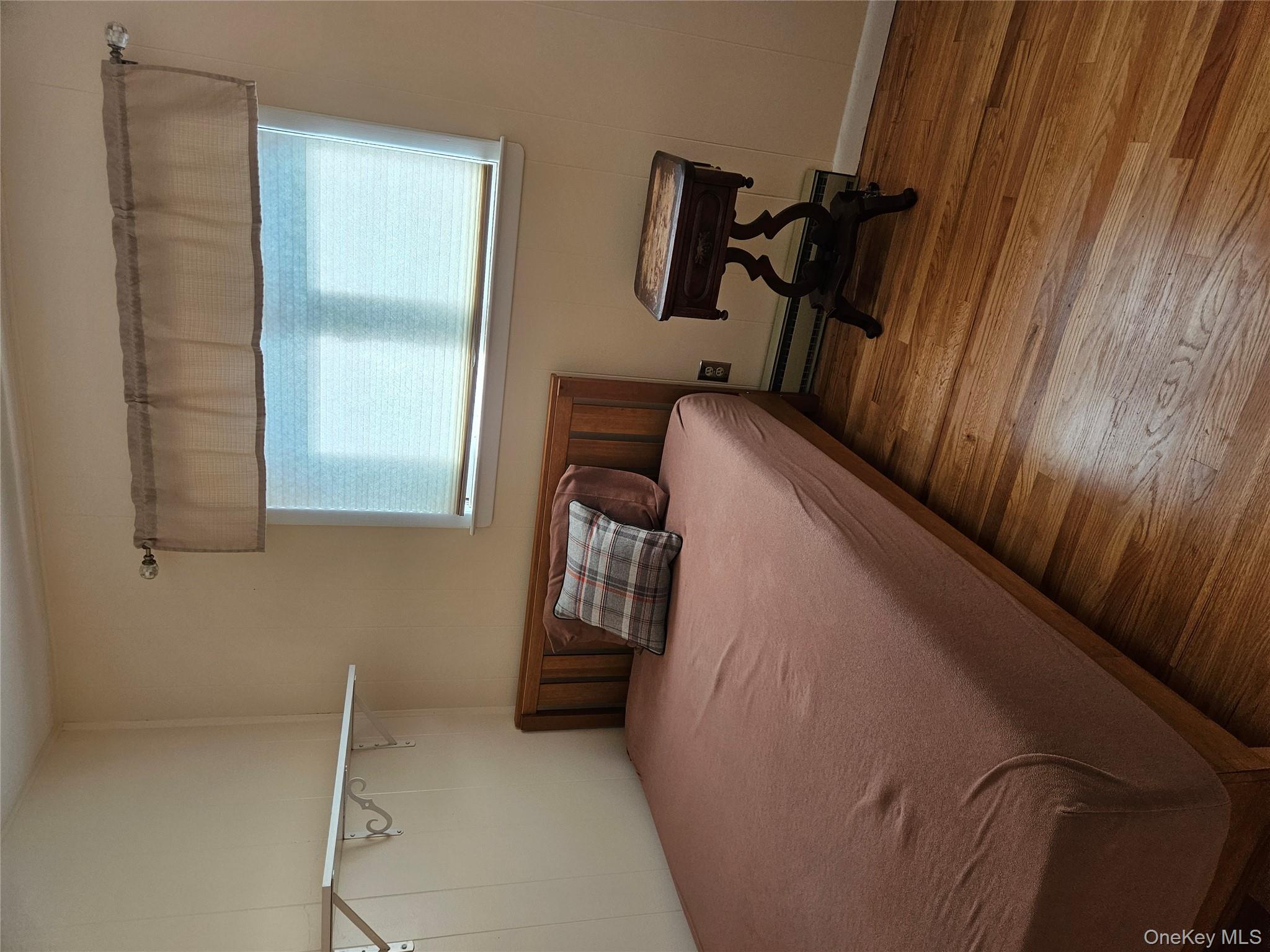 72 Crescent Circle Rock Hill, NY 12775 - Photo 11 of 15 a bedroom with a bed and a window