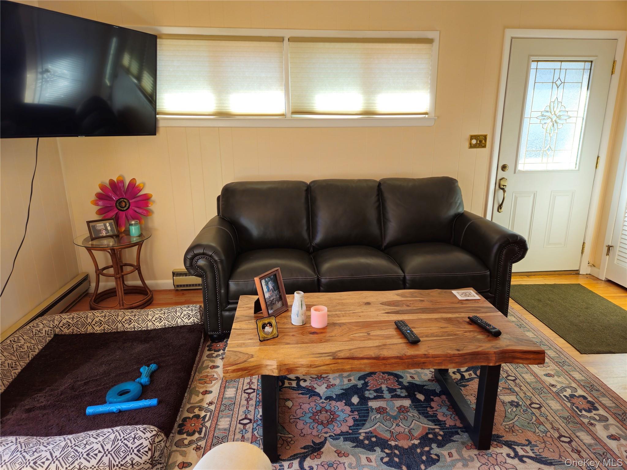 72 Crescent Circle Rock Hill, NY 12775 - Photo 3 of 15 a living room with furniture and a flat screen tv