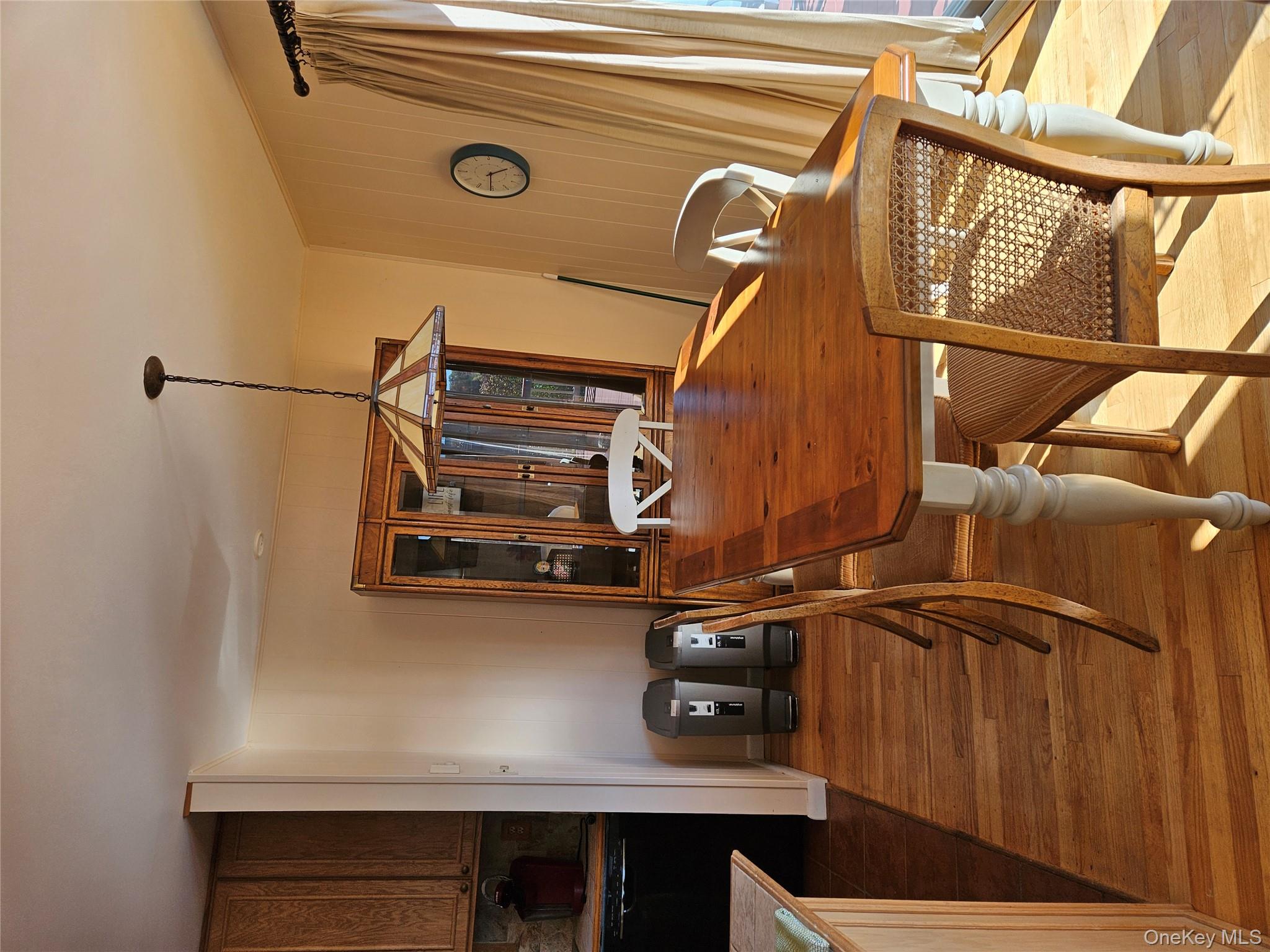 72 Crescent Circle Rock Hill, NY 12775 - Photo 5 of 15 a view of a dining room with furniture and wooden floor