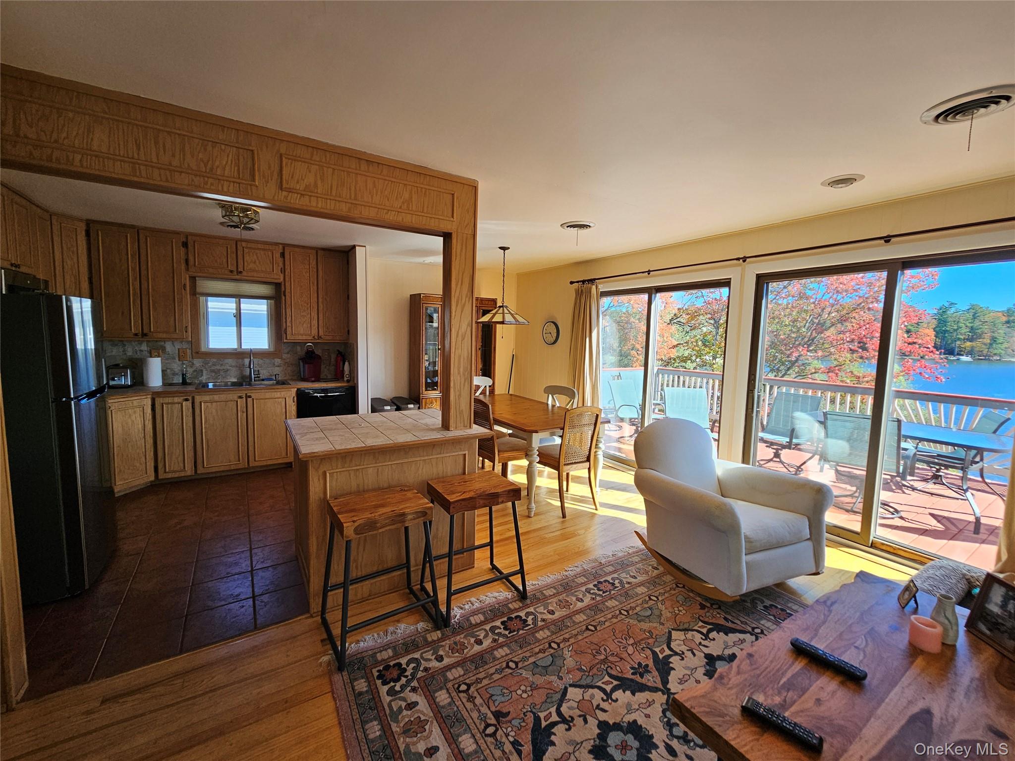 72 Crescent Circle Rock Hill, NY 12775 - Photo 6 of 15 a living room with furniture a large window and kitchen view