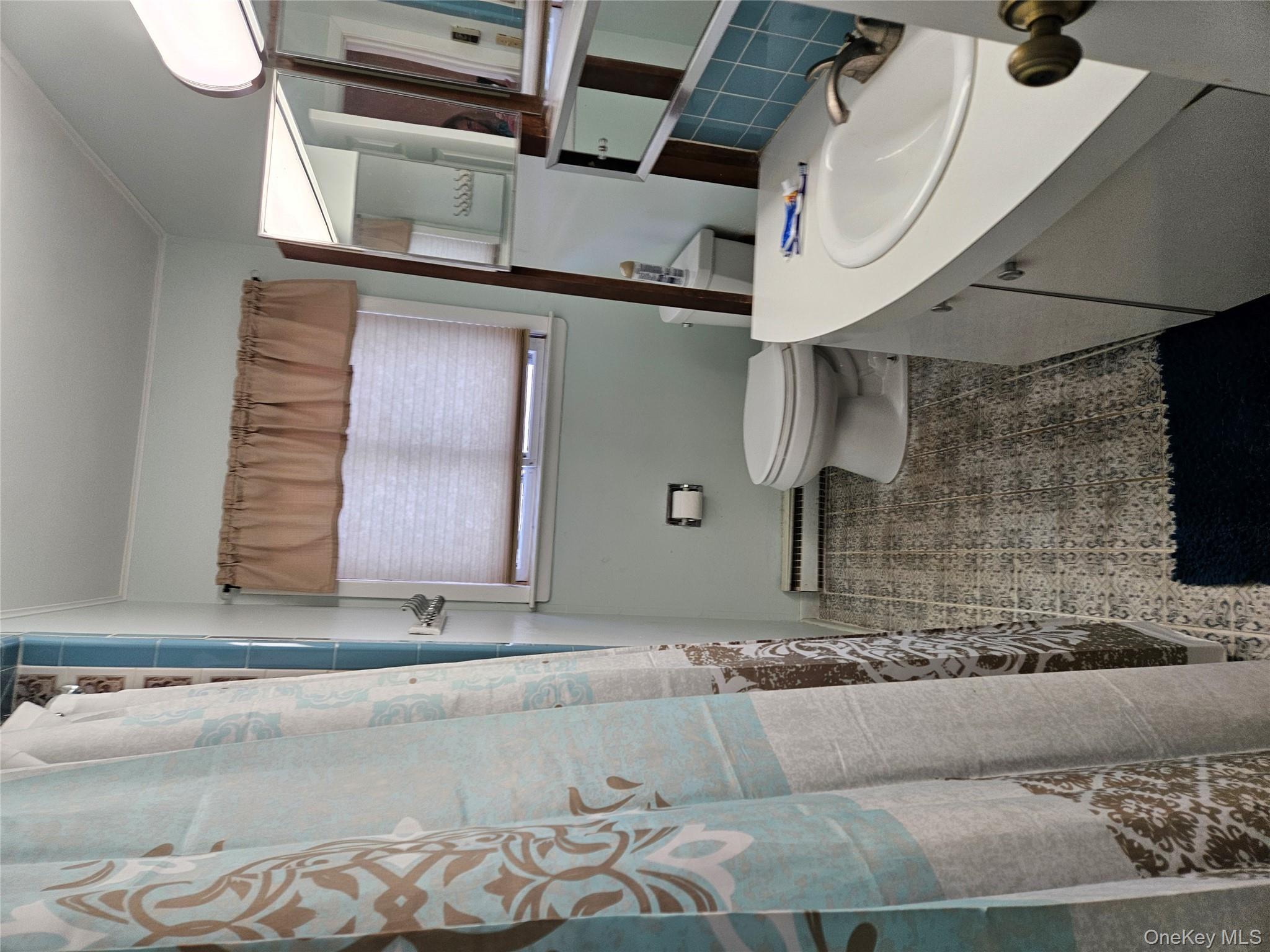 72 Crescent Circle Rock Hill, NY 12775 - Photo 7 of 15 a bathroom with a sink and a mirror