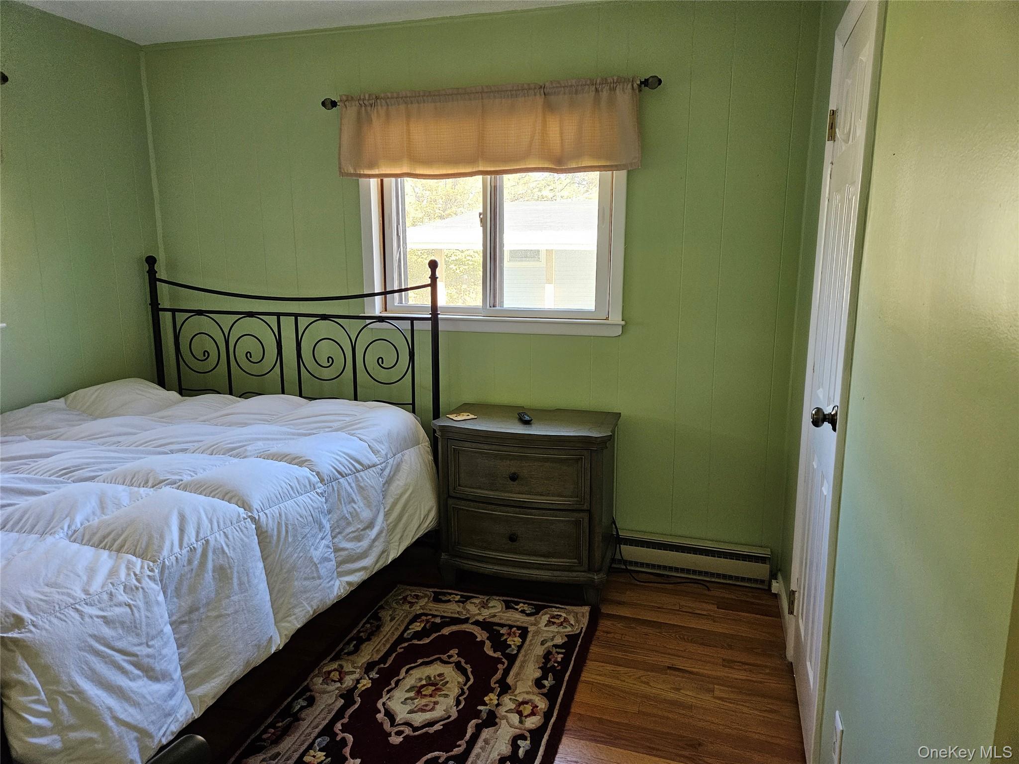 72 Crescent Circle Rock Hill, NY 12775 - Photo 8 of 15 a bed sitting in a bedroom next to a window