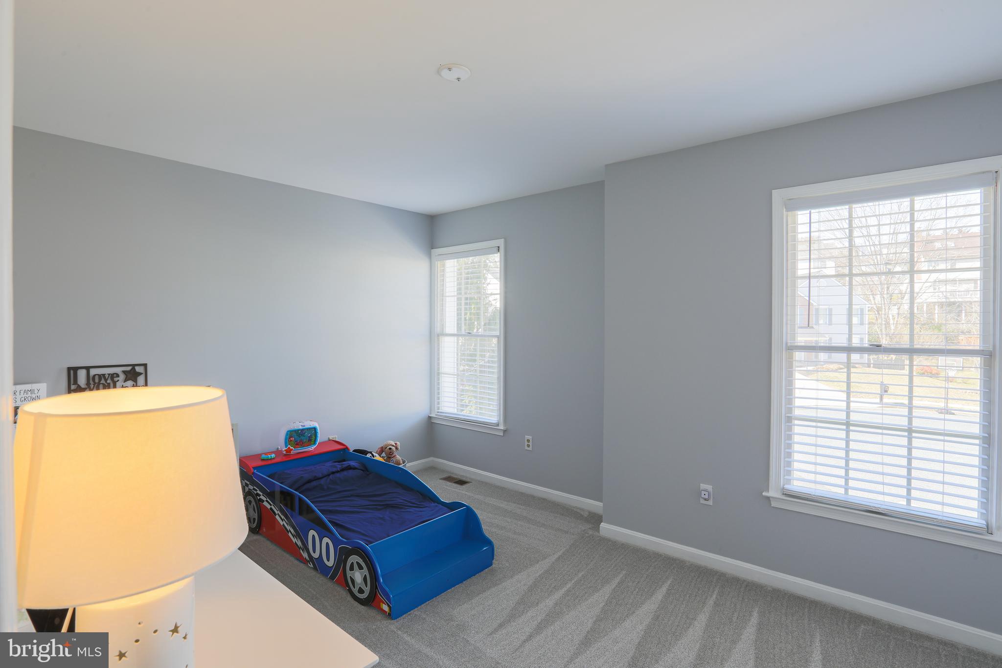 9547 Hallhurst Road Baltimore, MD 21236 - Photo 41 of 49 a room with a bed and window