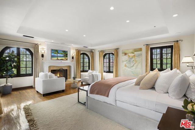 a room with furniture a large window and a sink