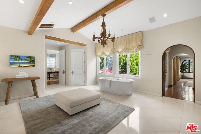 a view of a patio with table and chairs and potted plants