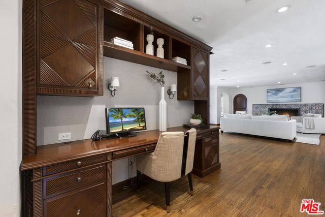 a bathroom with a granite countertop sink a toilet and shower