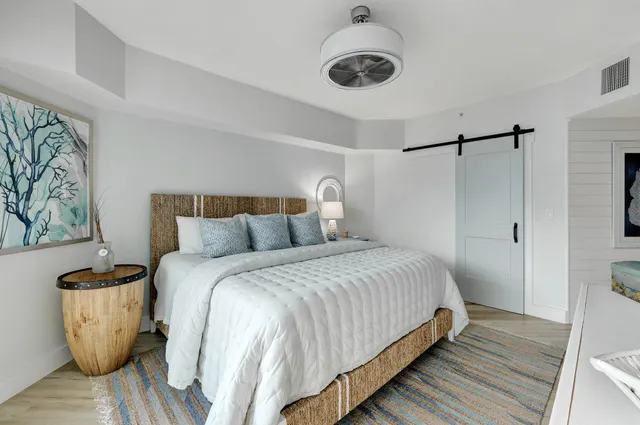 a bedroom with a bed and a television