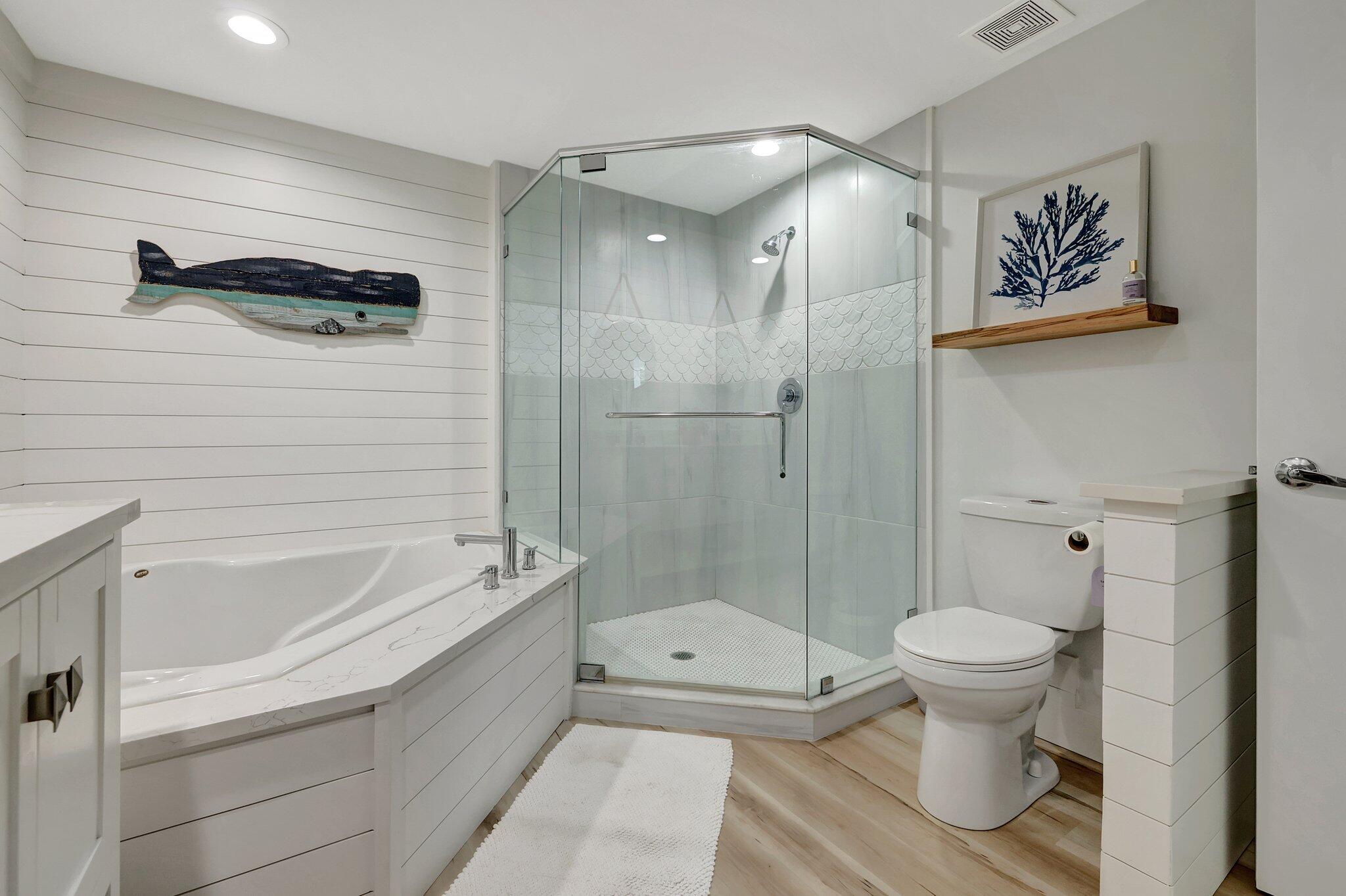 875 Northwest Flagler Avenue, Unit 404 Stuart, FL 34994 - Photo 19 of 56 a bathroom with a toilet and a shower