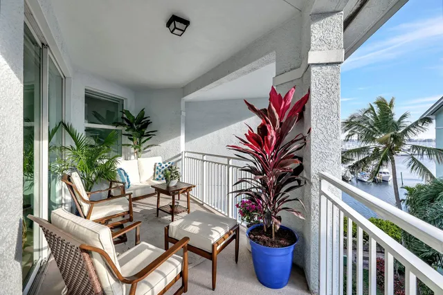 a view of balcony with potted plants