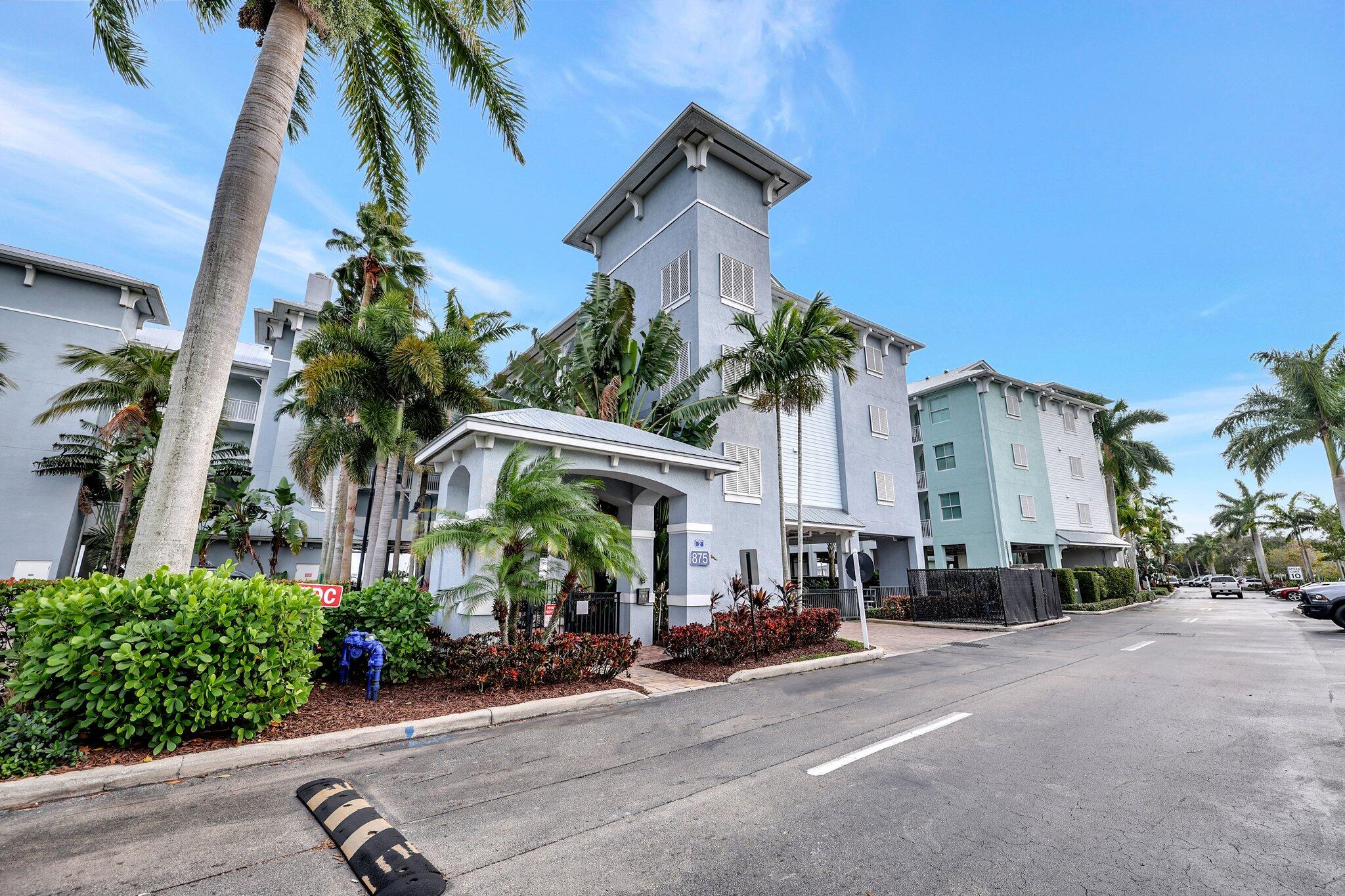 875 Northwest Flagler Avenue, Unit 404 Stuart, FL 34994 - Photo 46 of 56 a front view of a house with garden