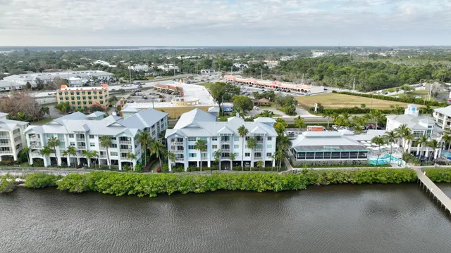 a front view of a building with lake view and boat