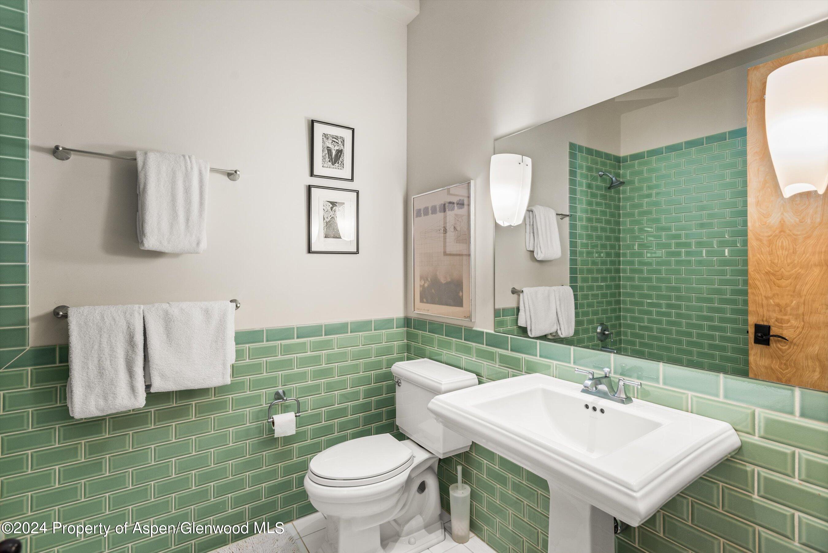 308 Park Avenue Aspen, CO 81611 - Photo 15 of 26 a bathroom with a sink toilet and mirror
