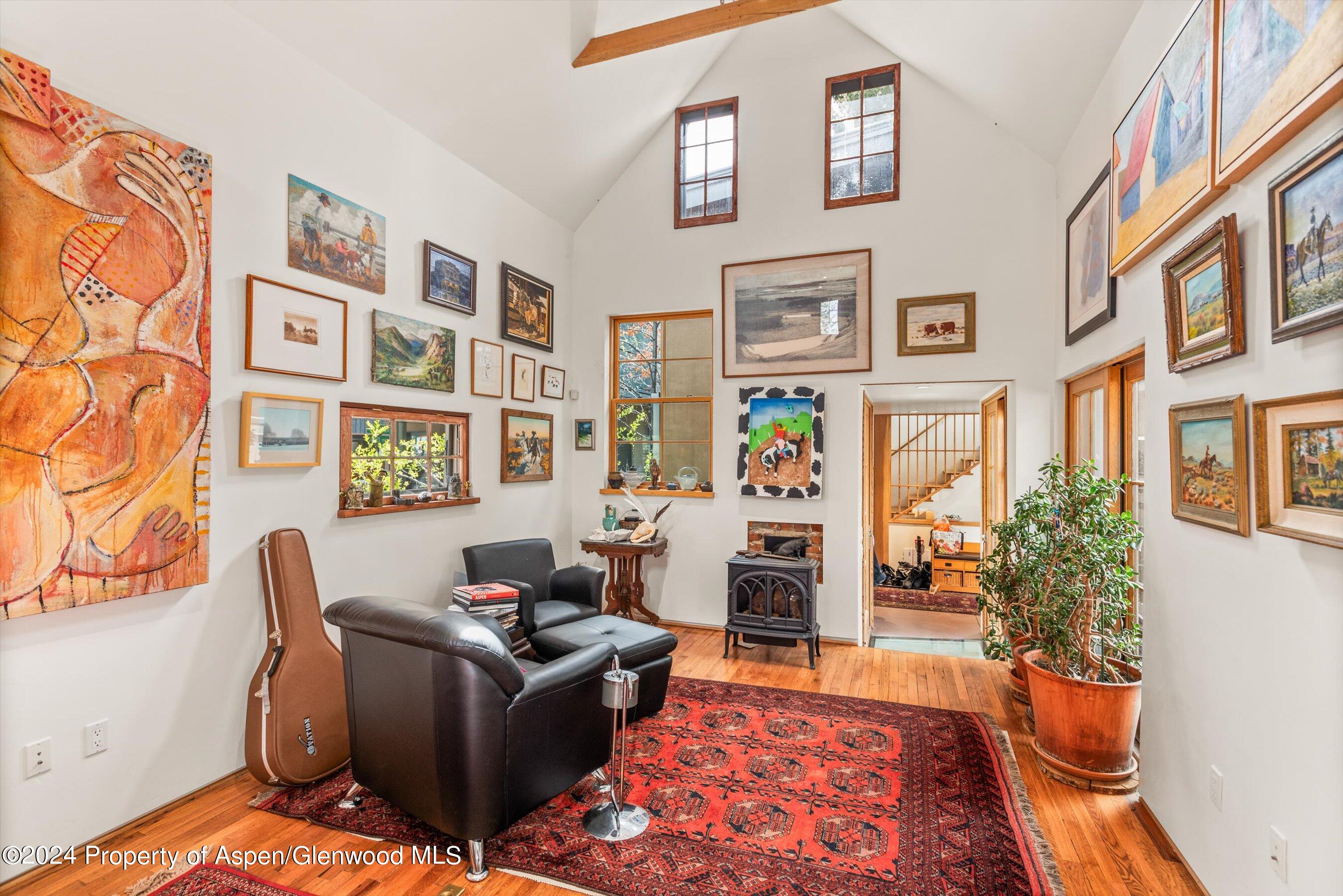 308 Park Avenue Aspen, CO 81611 - Photo 6 of 26 a living room with furniture and a rug
